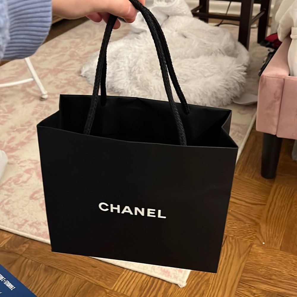 Chanel bag with 2 Chanel flowers and ribbon